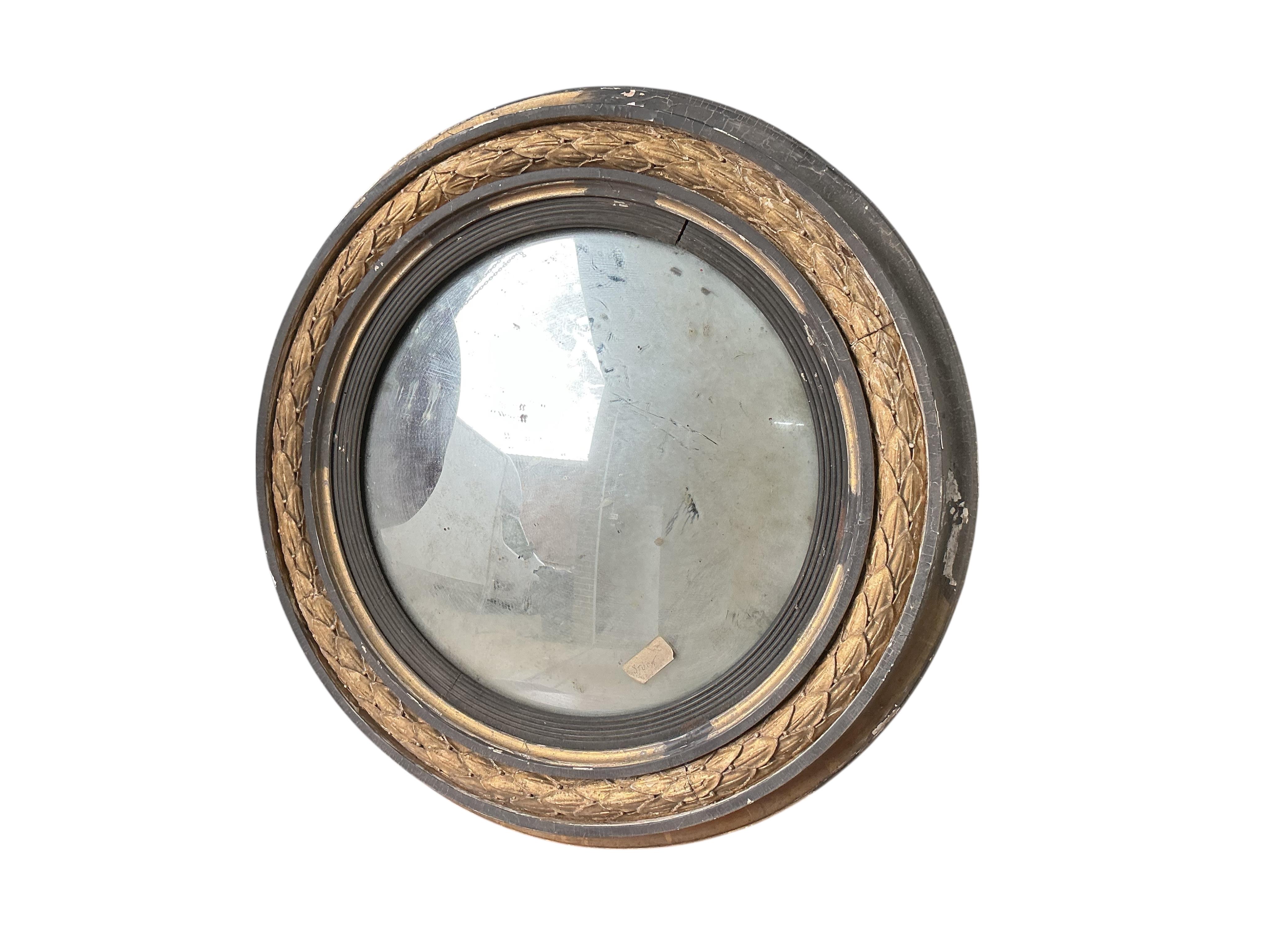 A Regency giltwood and composition circular convex wall mirror, in need of restoration, diameter 70cm